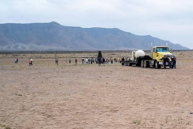 image shows: Somewhere in Australia, a huge truck delivers a mysterious cargo…